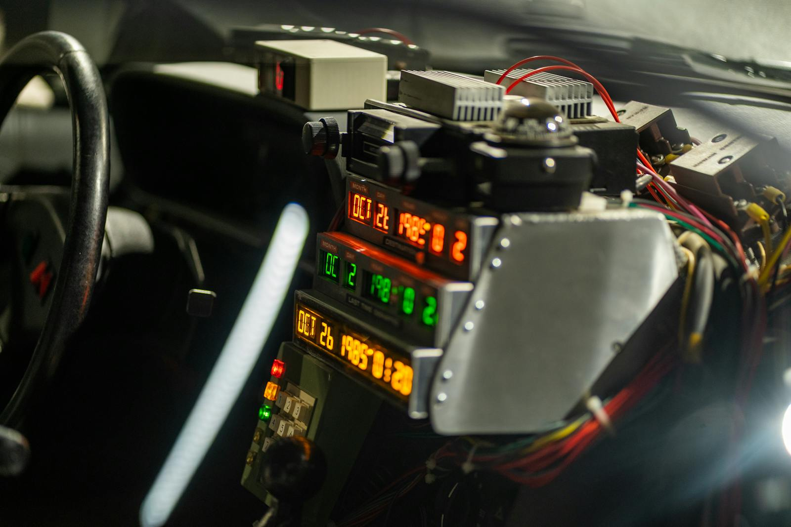 Intricate car dashboard featuring futuristic time-travel display and controls, evoking a sci-fi vibe.