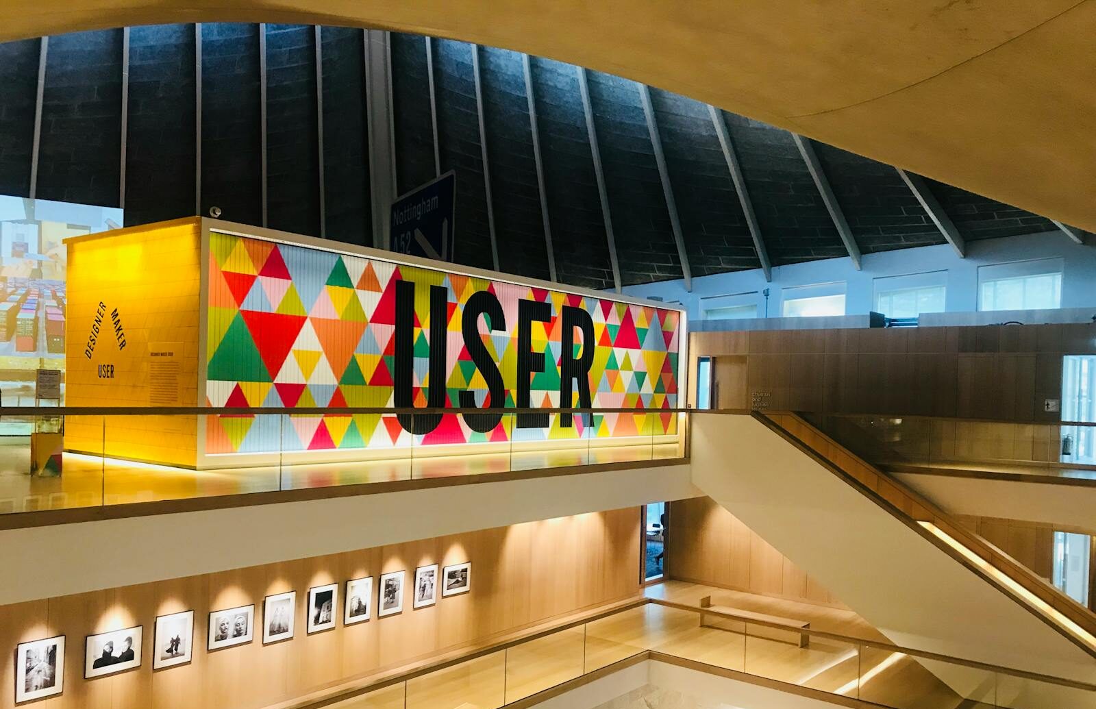 Spacious modern gallery in London featuring vibrant user typography and geometric design elements.