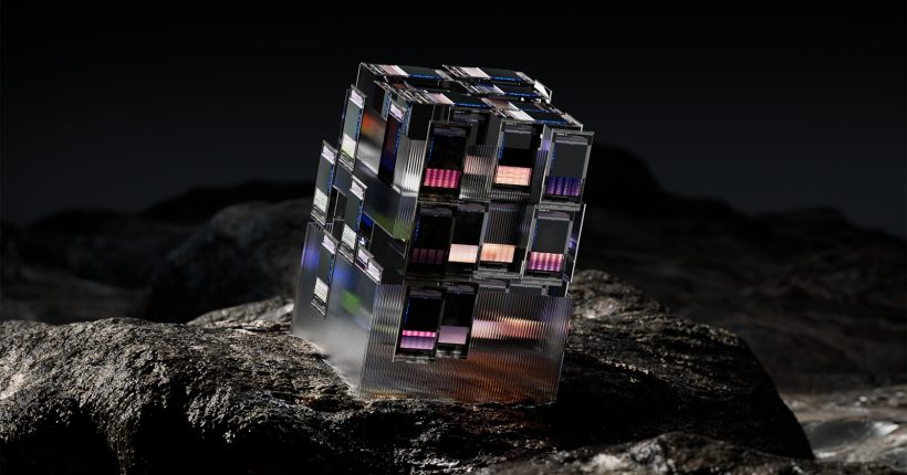a cube shaped building on a rock