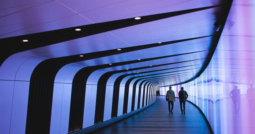 man walking through pathway
