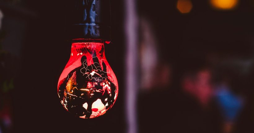 hanged red and black light bulb