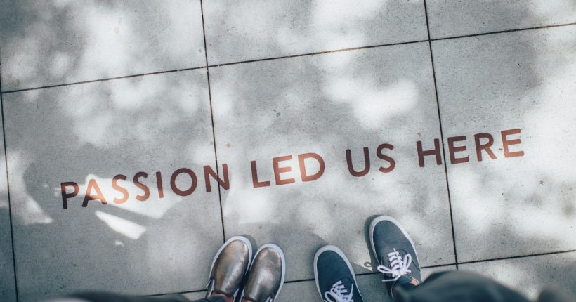 two person standing on gray tile paving