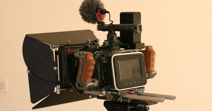 a camera with a microphone attached to it