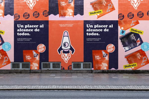 a row of posters on the side of a building