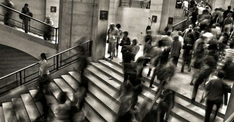 group of people walking on the stairs