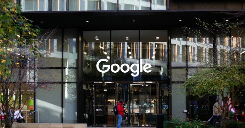 a man standing in front of a google building