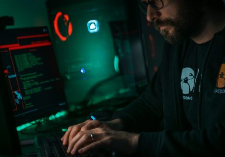 man in black jacket using computer