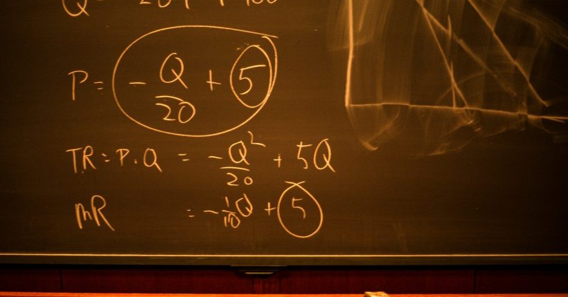 black chalk board with chalk writing