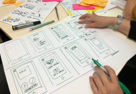 person writing on printing paper