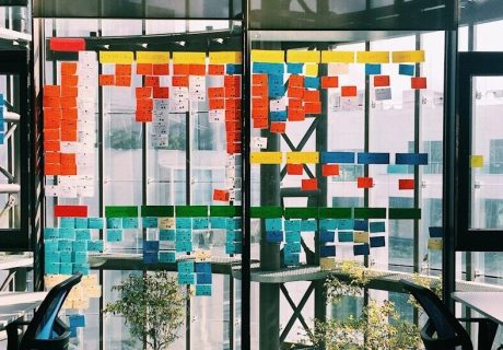 black rolling armchair under white table