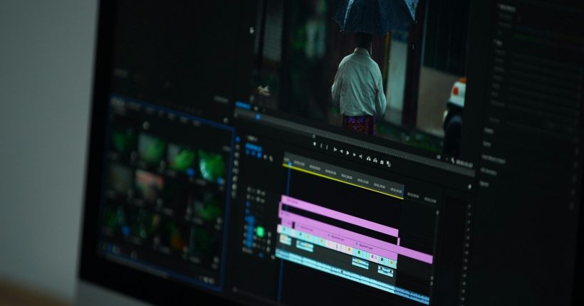 a computer screen with a person holding an umbrella