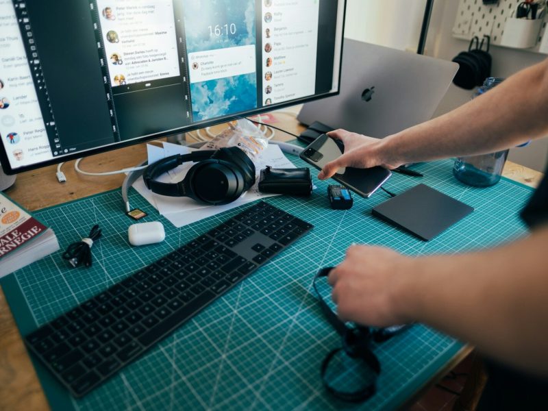 person using computer on table