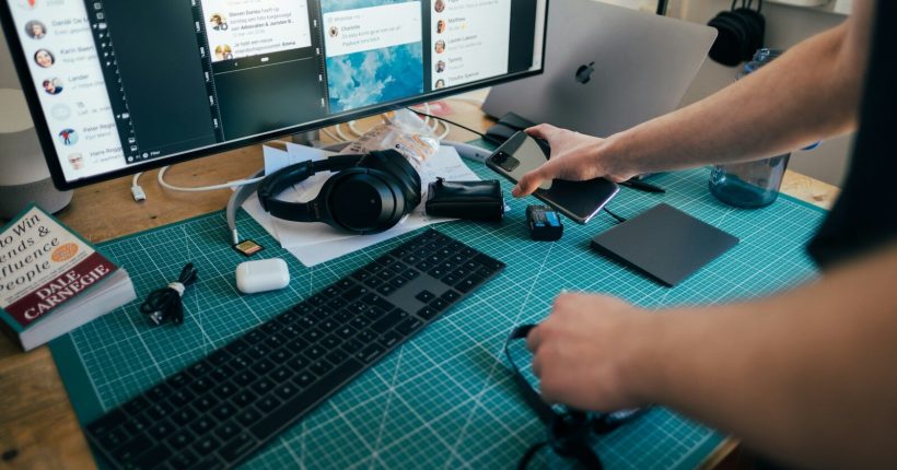 person using computer on table