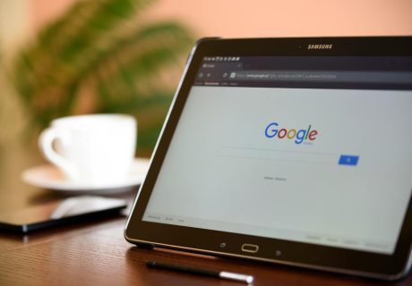Samsung tablet on desk showing Google homepage, perfect for technology-related content.