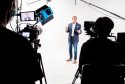 a man standing in front of a camera