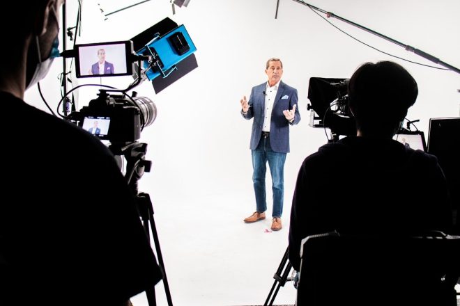 a man standing in front of a camera
