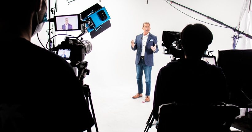 a man standing in front of a camera