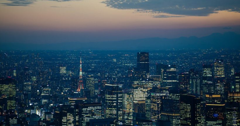 a view of a city at night from the top of a building
