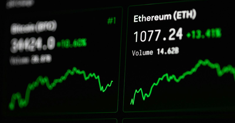 Close-up of cryptocurrency market data with Ethereum and Bitcoin prices on screen.