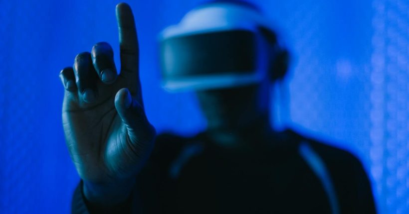Close-up of a person in a VR headset interacting, showcasing a modern technology setup.