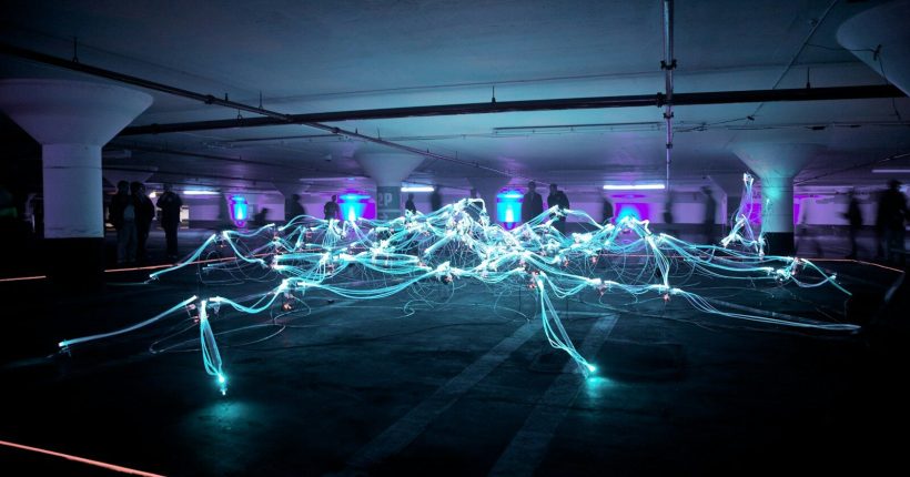 linked neon lights under white painted basement