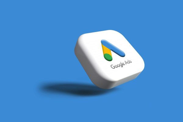 a white google logo on a blue background