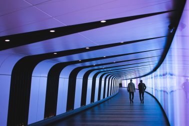 man walking through pathway