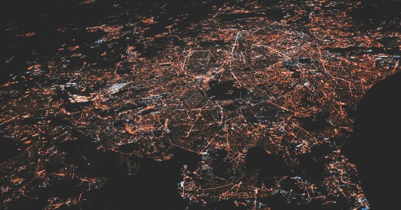 lighted city at night aerial photo