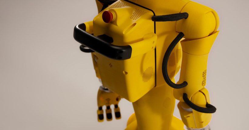 Yellow robot with black accents on a white background