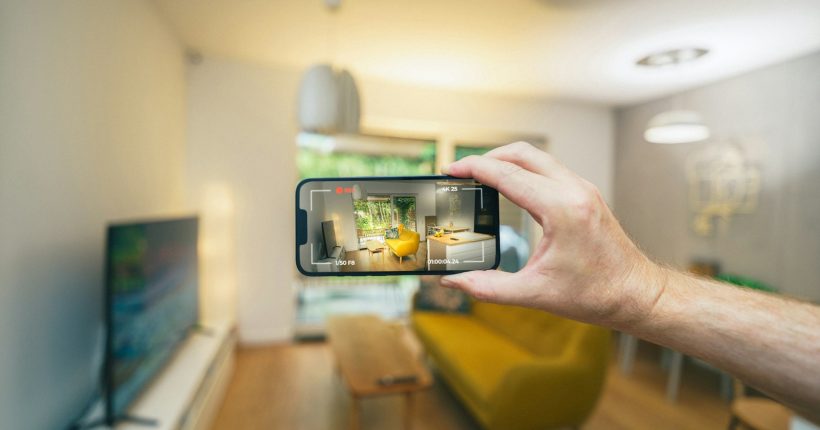 A person taking a picture of a living room