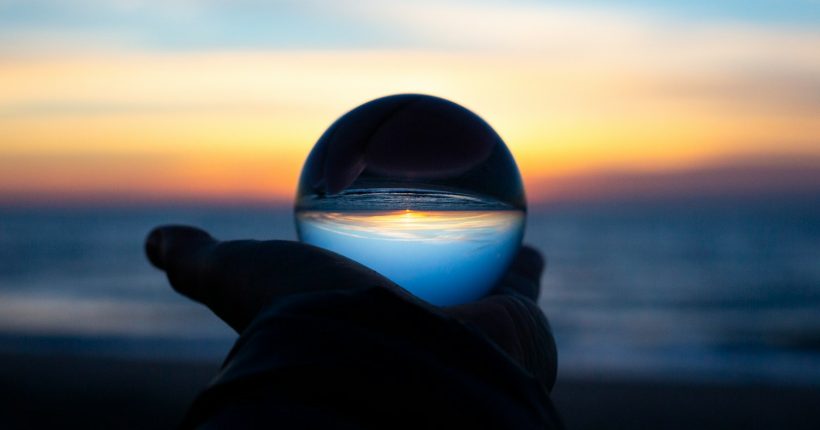 person holding clear glass glass