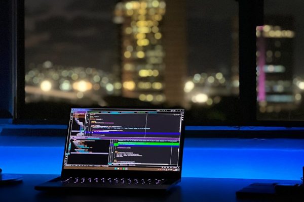 a laptop computer sitting on top of a desk