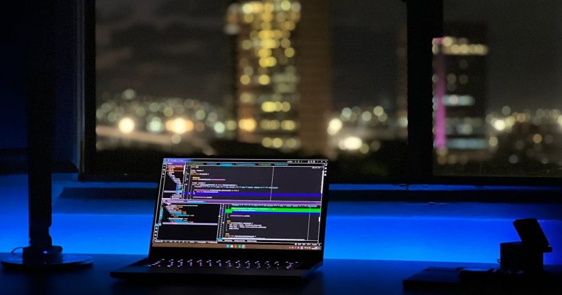 a laptop computer sitting on top of a desk